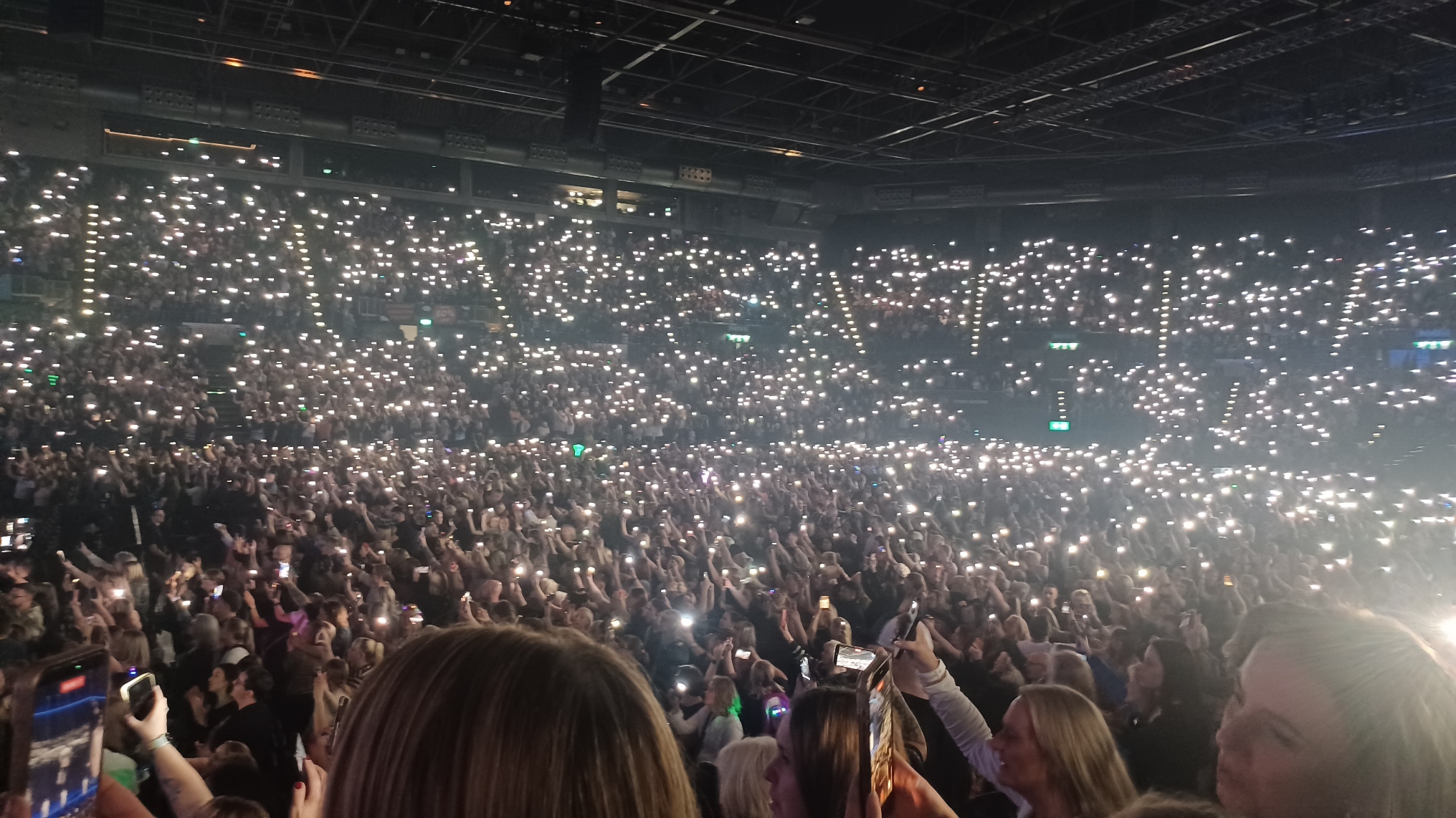 Arena crowd holding up phone lights during Westlife’s Birmingham anniversary show